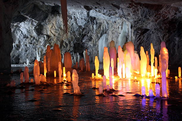 istock Frozen water Stalagmite in wild deep marble cave 532596075