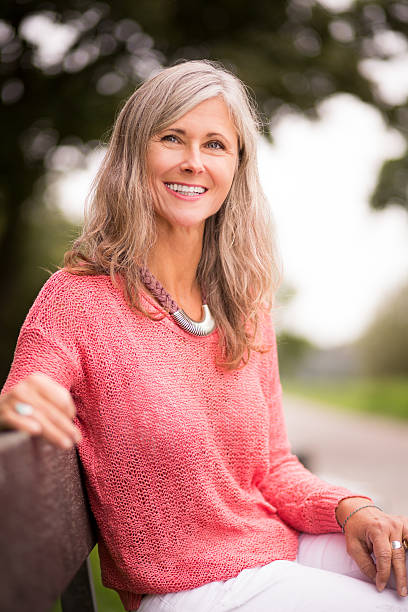 istock Mature Woman Sits On Park Bench 532604527