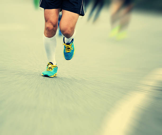istock marathon runner athlete running on city road 532604733