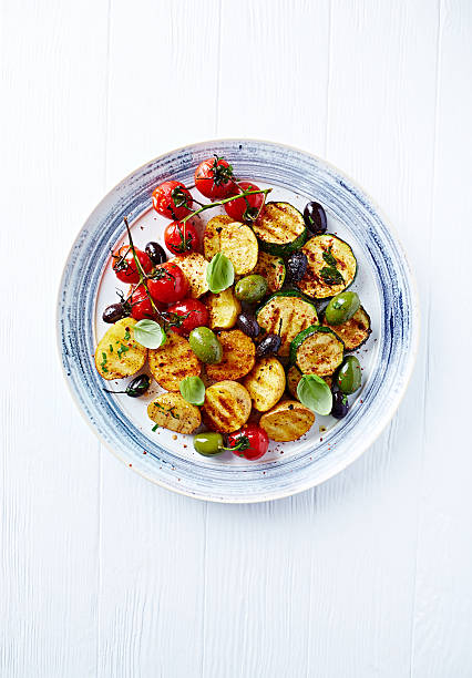 istock Grilled spiced vegetables with olives on a plate 532605043