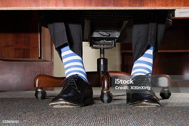 Businessman With Striped Socks Stock Photo - Download Image Now - Office, Bizarre, Sock