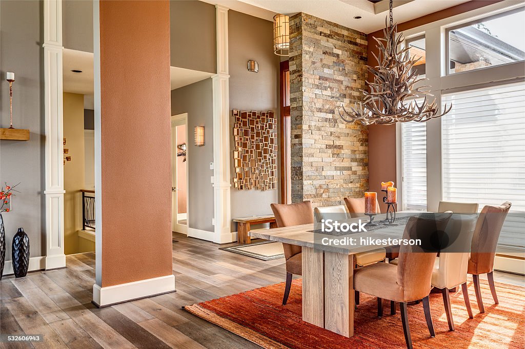Dining Room in Luxury Home Dining Room with Entryway, Table, Elegant Light Fixture Dining Room Stock Photo