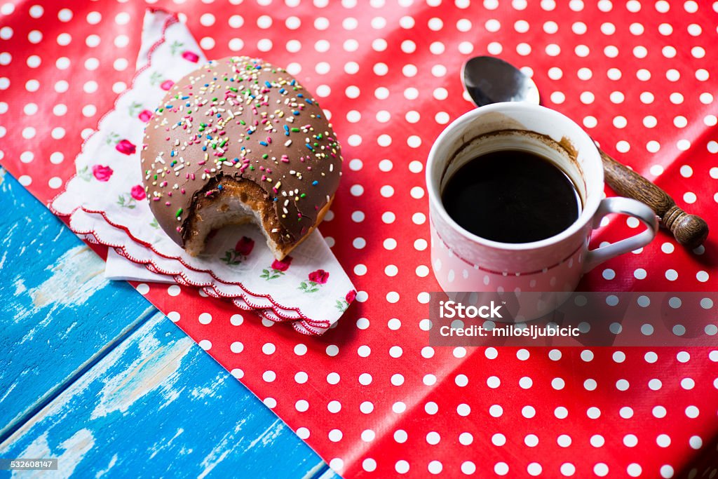 Donut Eating fresh donut with coffee for breakfast 2015 Stock Photo