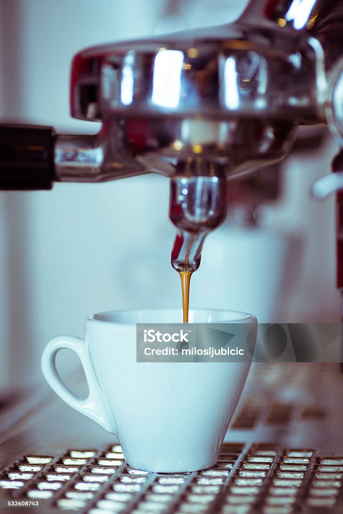 express Barista with tamper and piston/portafilter making espresso. 2015 Stock Photo