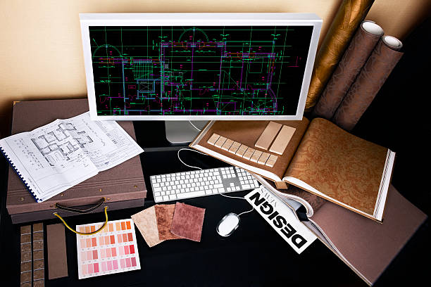 Interior designer's workplace Interior designer's workplace. Architectural project on computer monitor, architectural plan, catalogues, color swatches, tiles at the desk. blueprint fabric swatch tile color swatch stock pictures, royalty-free photos & images