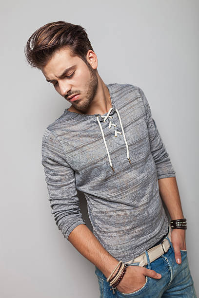 istock fashion man holding his hands in pocket 532609437
