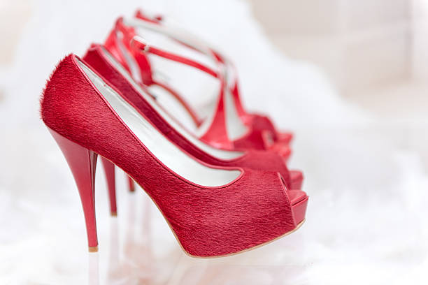 Red high-heeled leather shoes stock photo