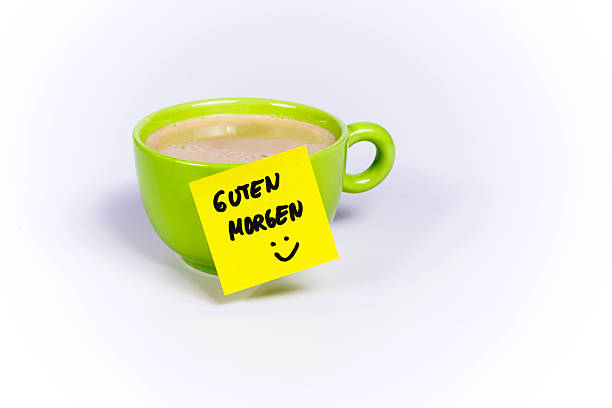 Green cup of coffee, organic coffee, post-it note good morning