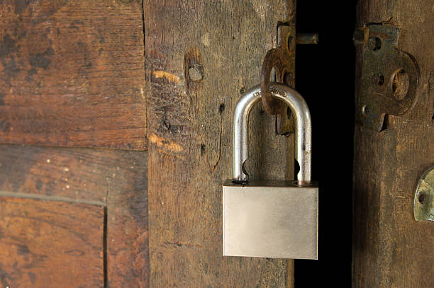 istock padlock on a wooden door 532611629