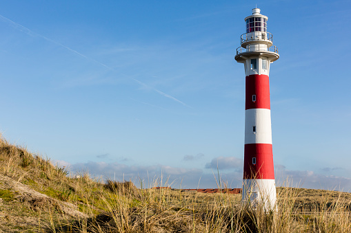 the lighthouse of nieuwpoort with dunes