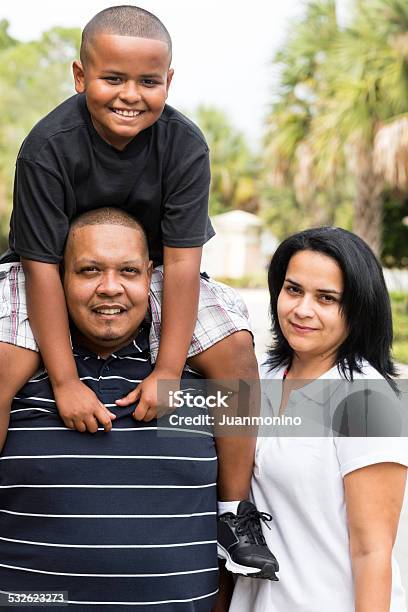Middle Aged Man And Woman With A Young Boy Stock Photo - Download Image Now - Family, Overweight, Immigrant