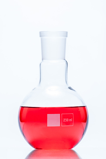 Spherical flat bottomed temperature resistant flask with red liquid