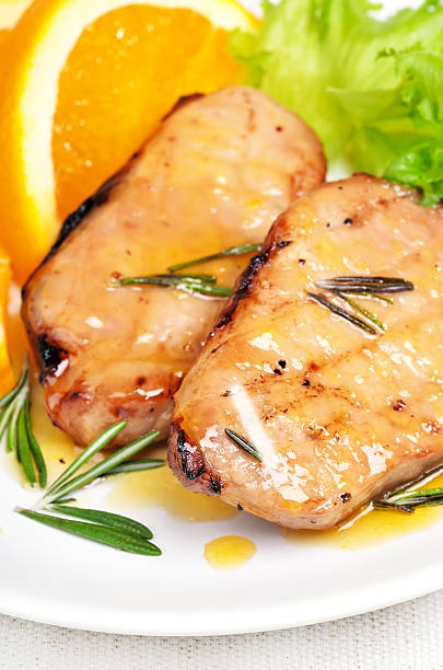 istock Roasted pork chop with orange sauce 532625043