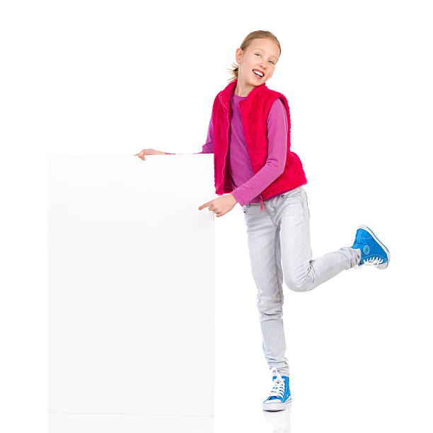 istock Smiling girl posing with a placard 532628635