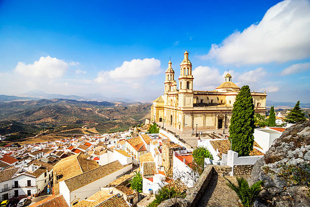 Town and Church Olvera, Cadiz Province, Andalusia, Spain. Elevated view of the town and Church (Parish of Our Lady of the Incarnation), Olvera, Cadiz Province, Andalusia, Spain.  grazalema stock pictures, royalty-free photos & images