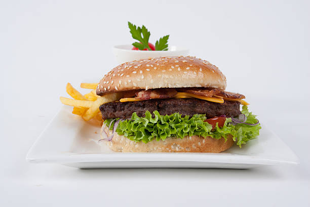 Fresh Hamburger with french fries and salad stock photo