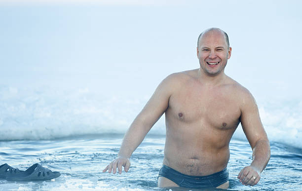 istock cheerful Man  ice-hole at frosty day 532641437