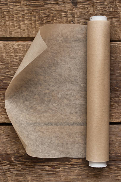 istock open roll of paper on the wooden table background 532641537