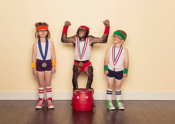 szympans champion z złoty medal i małych dzieci - group of people 1980s style image created 1980s exercising zdjęcia i obrazy z banku zdjęć
