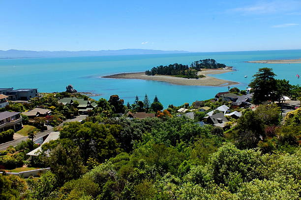 Sandy island and clear blue ocean view from village hill Sandy island and clear blue ocean view from village hill nelson city new zealand stock pictures, royalty-free photos & images
