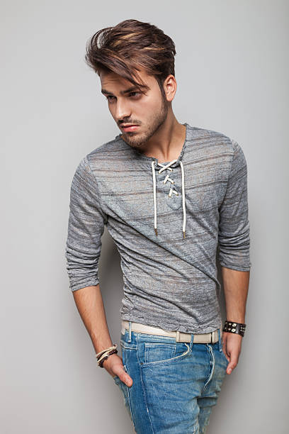 istock young fashion man looking away from the camera 532642633