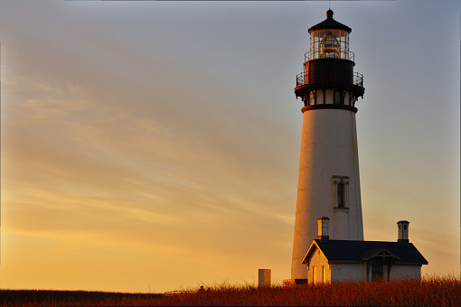 Lighthouse at sunset, at Yaquina Head, Newport, Oregon.