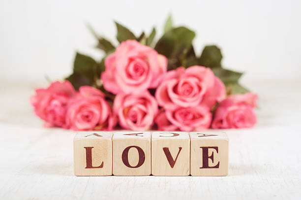 istock Word love with roses on background 532643643