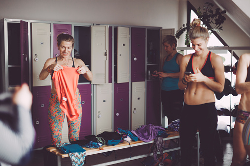 Women preparing for yoga in the dressing room