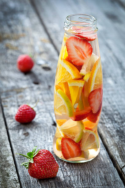 istock Fresh fruit detox water in bottle on wooden table 532646947