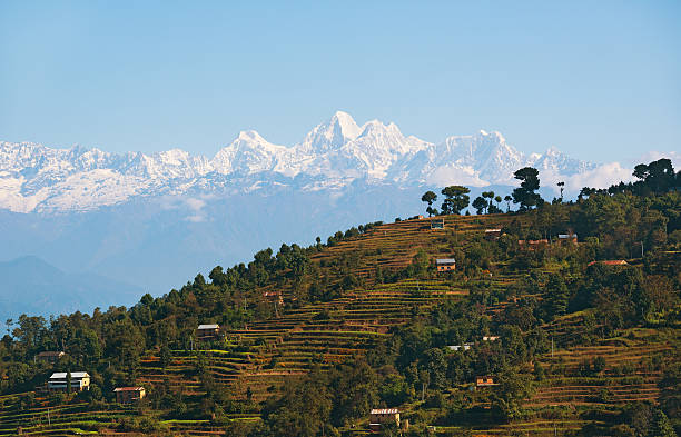 Himalayan village with snow mountain backdrop View of Himalayas in Nepal nagarkot photos stock pictures, royalty-free photos & images