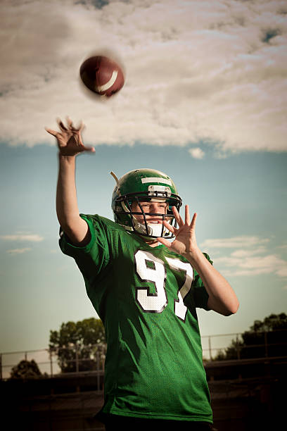 istock American Football Quarterback Passing the Ball 532647821