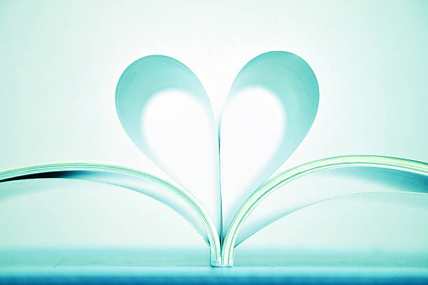istock Beautiful blue heart shape of book pages. 532648281
