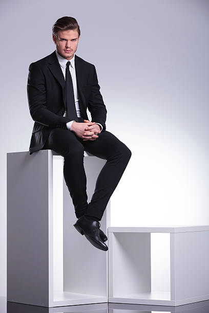istock business man sitting while holding his hand together 532648649