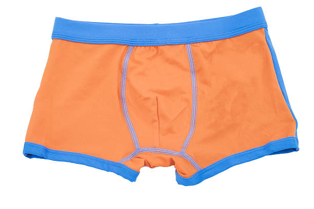 istock Children's orange swimming shorts isolated on white background. 532665187