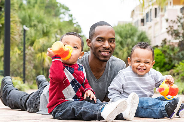 istock Little twins with their dad 532665391