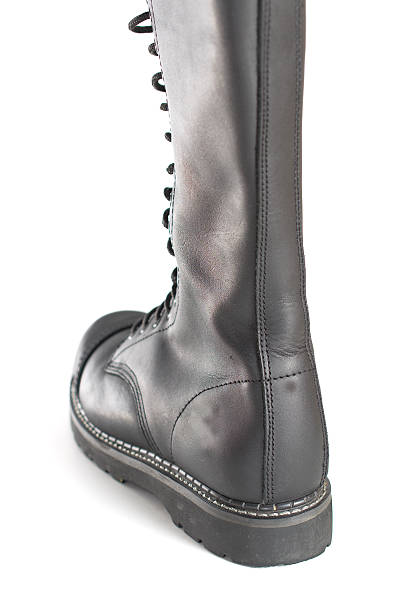 istock New knee high lace up black combat boot 532665575