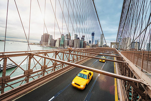 istock Cab on Brooklyn Bridge in Front of Manhattan Skyline 532665731