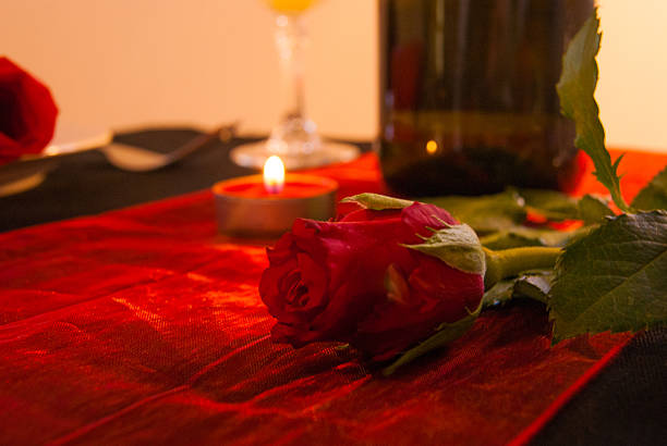 Valentine's Table - Candlelit with red rose & wine bottle