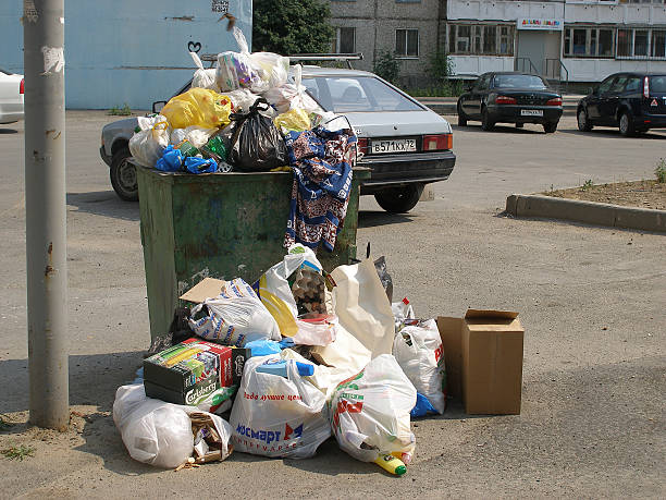 istock garbage tank on the street, overflowed with waste 532667019