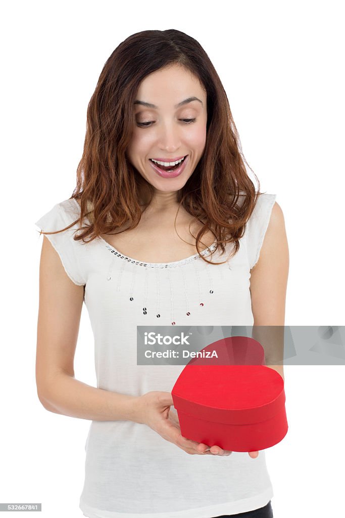 Surprised valentines day woman Valentines day woman opening her heart shaped gift box, surprised and happy, smiling, isolated on white background. Love and valentines day concept 2015 Stock Photo