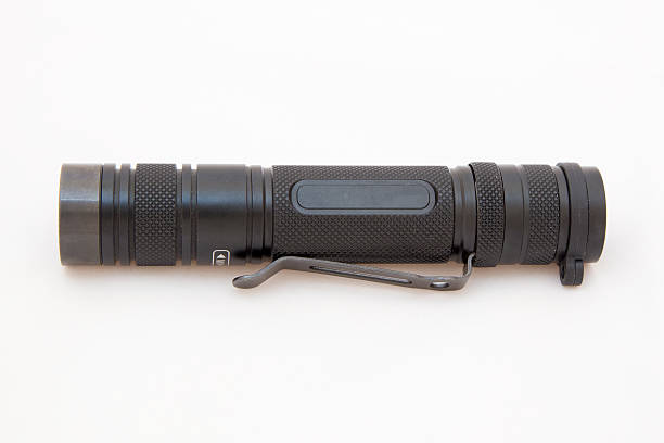 torcia tattica nero isolato su bianco - tactical flashlight foto e immagini stock