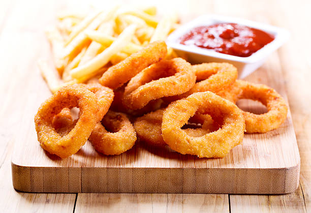 istock onion rings and fried potato with ketchup 532669443