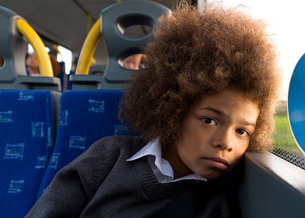istock Depressed Schoolboy Sitting Alone on Bus 532669723