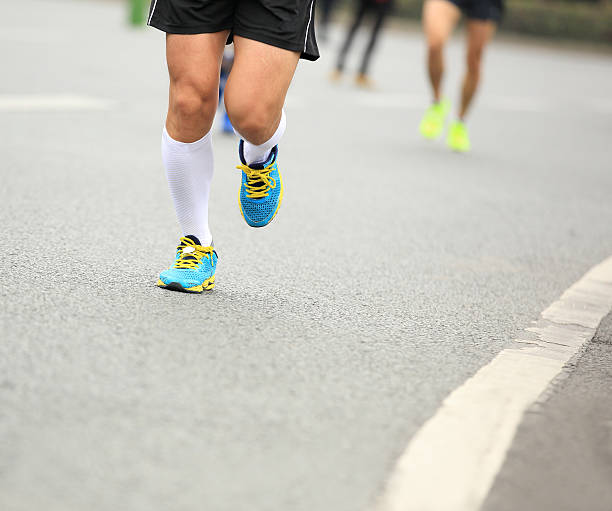 istock marathon runner athlete running on city road 532670047