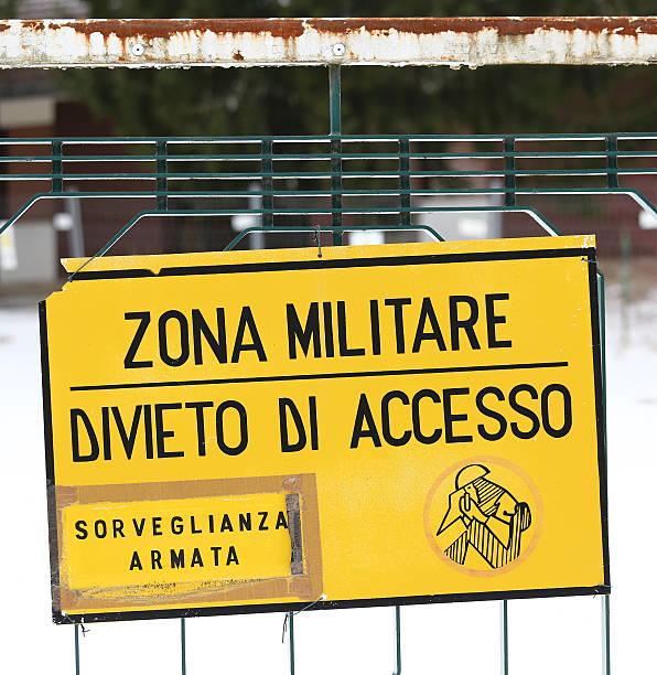 military zone sign off from a military base in Italy attention military zone sign off from a military base in Italy impassable limit stock pictures, royalty-free photos & images