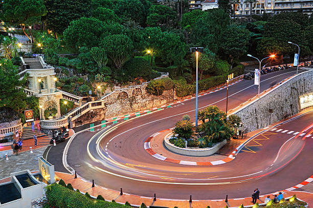 Grand Hotel hairpin in Monaco Monte Carlo, Monaco - October 07, 2014: The Grand Hotel hairpin in Monte Carlo at night on October 07, 2014 in Monaco. Monte Carlo is host to the Formula One Monaco Grand Prix.  monaco stock pictures, royalty-free photos & images