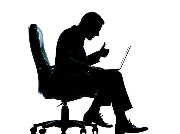 istock one business man computer computing sitting in armchair silhouet 532683131