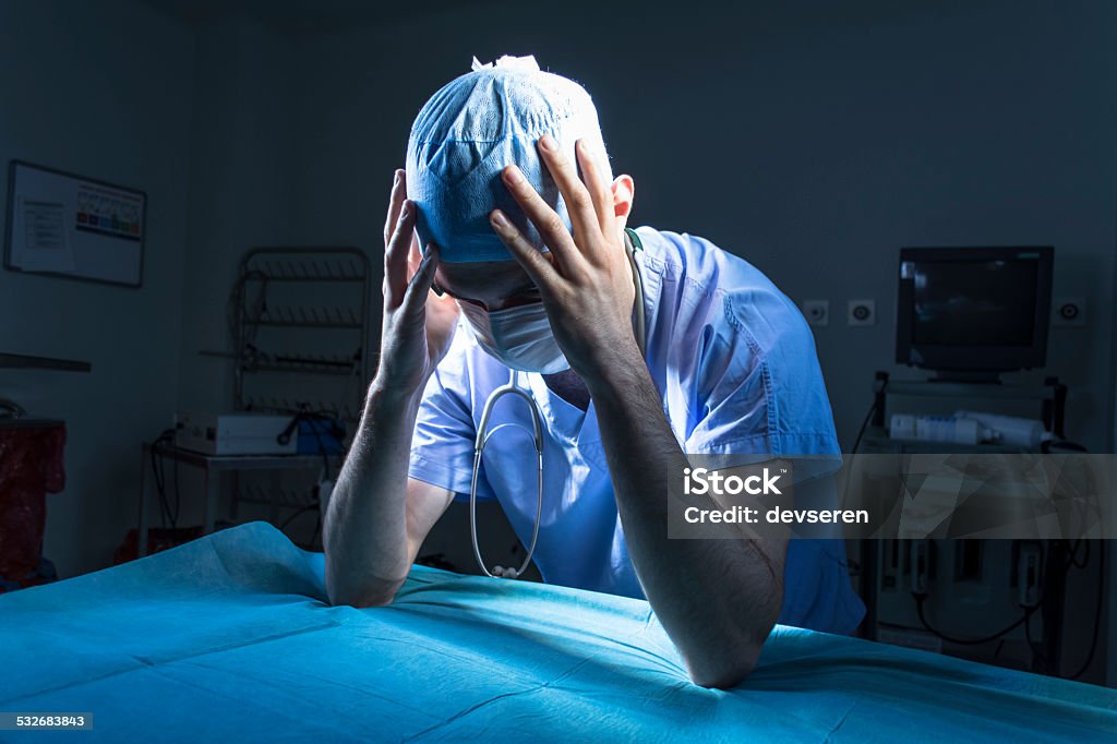 Doctor Doctor in the middle of a surgery.Doctor in the middle of a surgery. Mistake Stock Photo