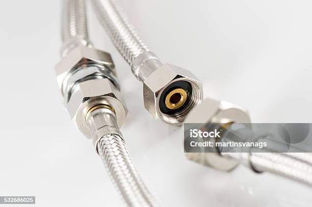 Elastic Metal Fiber Water Pipe With Connectors Stock Photo - Download Image Now - 2015, Chrome, Fastening