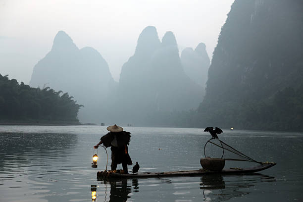 istock Fishing with cormorants birds in Yangshuo 532686795